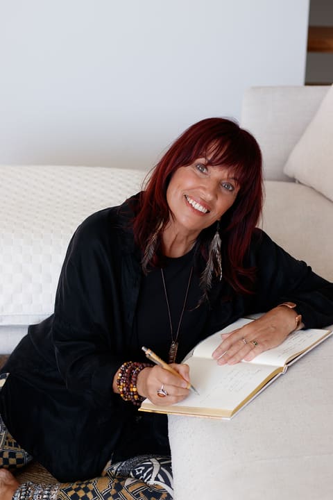 Dawn writing, relaxed and smiling